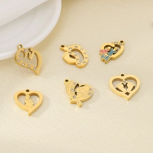 Detailed view of heart-shaped stainless steel pendants with enamel and crystal accents