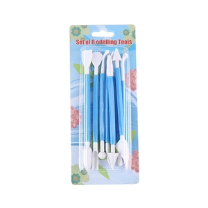 Set of 8 blue and white plastic modeling tools for fondant and clay in retail packaging