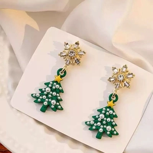 Elegant Christmas tree earrings with golden snowflakes and green tree pendants on silk