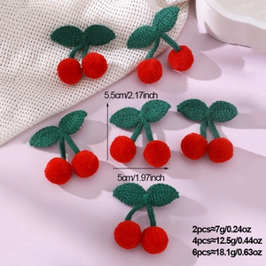 Detail view of handmade crochet cherry hair clips showing dimensions and weight metrics