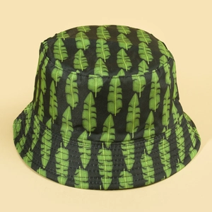 Double-sided bucket hat with black and green tropical banana leaf pattern for sun protection