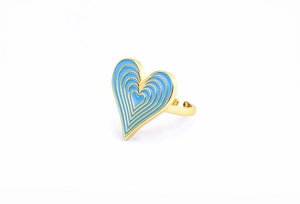 Macro view of blue enamel heart-shaped 18K gold plated ring with adjustable band detail