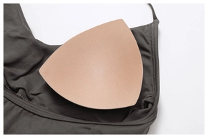 Detail of deep olive green seamless yoga top with removable triangular padded cups