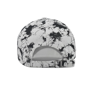 Detail of tie-dye baseball cap featuring adjustable silver metal buckle and strap