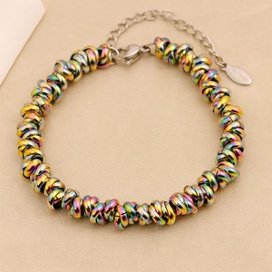Macro detail of rainbow stainless steel braided chain bracelet with lobster clasp