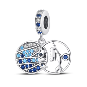 Detailed view of silver mermaid pendant with gradient blue and white zircon stones