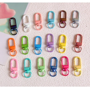 Detailed macro view of 18 colorful metal lobster clasps for DIY jewelry making