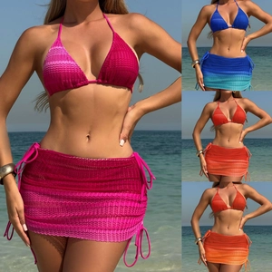 Close-up of crochet knit texture and gradient mesh fabric on three-piece bikini set