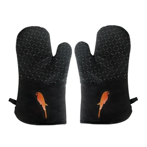 Close-up of black silicone oven mitts with diamond texture and parrot silhouette detail