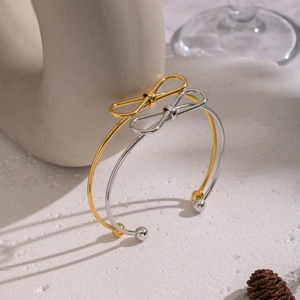 Minimalist bow knot open bangle in polished gold and silver stainless steel finishes