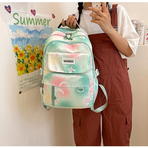 Detail of gradient pink mint backpack with butterfly moon prints for school girls