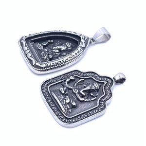Detailed relief carving of Ganesha deity on vintage silver stainless steel pendants