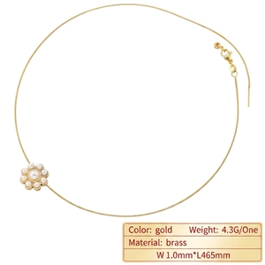 Elegant gold flower necklace with artificial pearl petals on a delicate chain