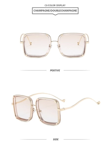 Detail view showing champagne gradient lenses and curved metal temples of oversized sunglasses