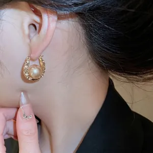French style U-shaped gold hoop earrings with sparkling diamonds and champagne pearls