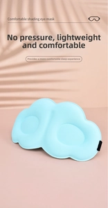 Close-up of ergonomic 3D cloud sleep mask in light blue with breathable fabric