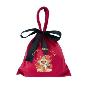 Red velvet drawstring gift bag with gold Year of the Dragon graphics and a black ribbon bow