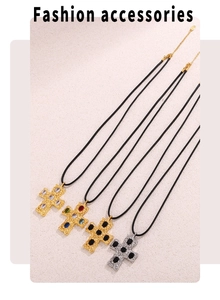 Detail of cross necklaces with hammered metal texture and colorful gemstones