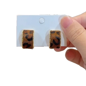 Leopard print C-shaped gold hoop earrings with brown fabric texture for women