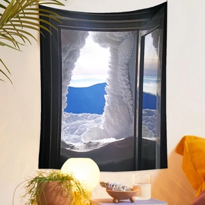 Detail of wall tapestry featuring a snowy mountain window view in a cozy room setting