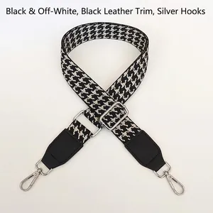 Adjustable houndstooth shoulder strap with black leather trim and silver metal hooks