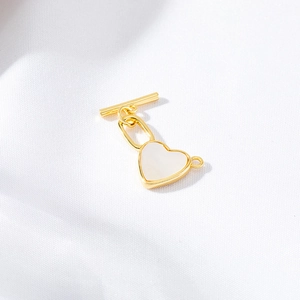 Minimalist golden heart OT toggle clasp for DIY jewelry making on white fabric