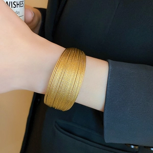 Minimalist gold plated multi-layer geometric cuff bracelet with textured metallic rings