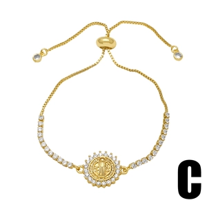 Gold adjustable St. Benedict medal bracelet with sparkling cubic zirconia pavé setting