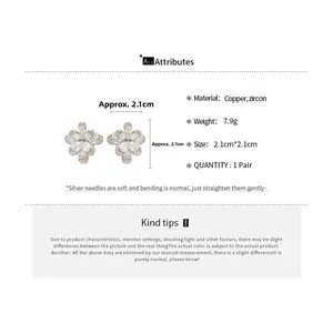 Detail view of flower-shaped zircon ear clips with dimensions 2.1cm and silver finish