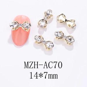 Detail von 14x7mm Schleifen-Nagelschmuck mit Strasssteinen und Goldlegierung Plattierung
