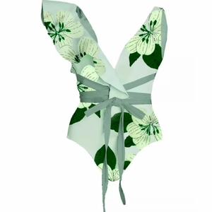 Detail of mint green floral swimsuit featuring ruffled V-neckline and tie waist design