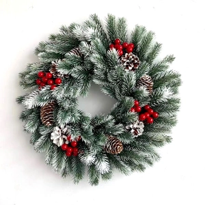 Classic Christmas wreath with LED lights, snow-flocked pine needles, red berries, and cones