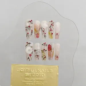 Handmade press-on nails featuring cherry art, ink bamboo patterns and luxury 3D charms