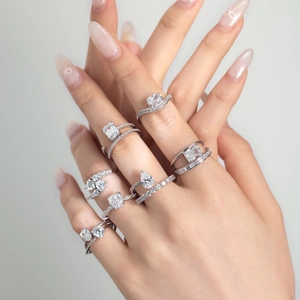 Macro detail of S925 sterling silver rings with mixed cut zircon stones on a hand
