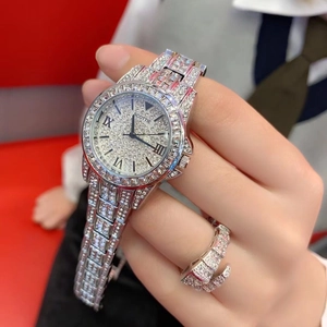 Luxurious silver quartz watch for women with full diamond pavé and matching snake ring set