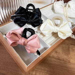 Elegant satin ribbon bow hair claw clips with rhinestones in black, pink, and cream white