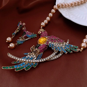 Detailed view of vintage parrot necklace with multicolor crystals and faux pearls