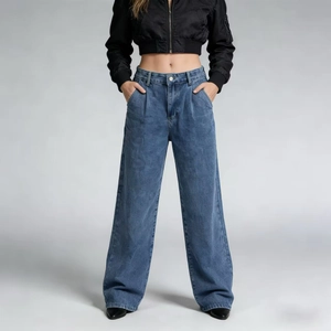 Detail of high waisted wide leg jeans with pleats and side pockets in washed blue denim