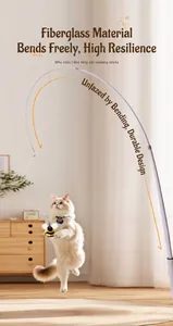 Action shot of a Ragdoll cat jumping for the bee plush toy on a flexible wand