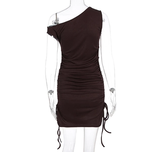Rear view of a bodycon knit dress featuring ruching details and adjustable side drawstrings