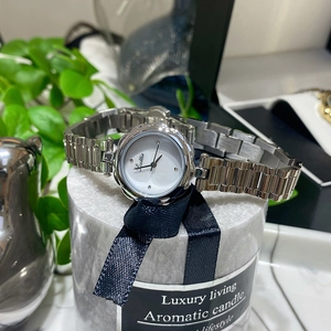 Elegant women's quartz watch with floral silver steel band and minimalist white dial