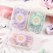 Pastel stationery set including paper clips and binders in pink green and purple cases