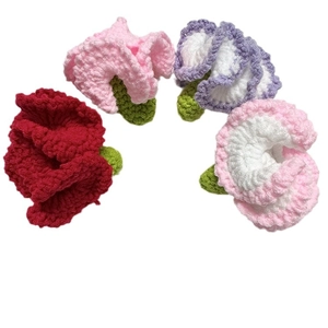 Handmade crochet flowers set including red, pink, and purple roses on white background