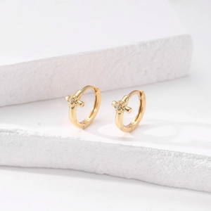 Close-up of S925 sterling silver gold-plated hoop earrings with cross star and zircon