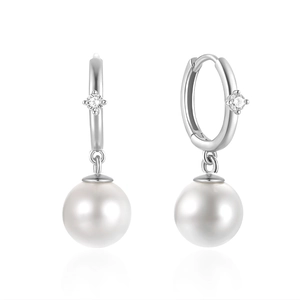 Detail of silver pearl drop earrings with zircon studs and white round pearls