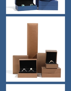 Detail of navy blue and bronze jewelry boxes with velvet lining for rings and necklaces