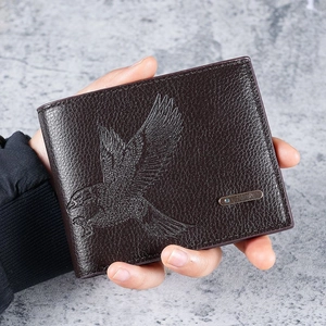 Men's slim brown bifold leather wallet featuring an embossed eagle design and metal accent