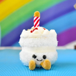 Cute white cake-shaped plush doll pendant featuring a candle and smiling face.