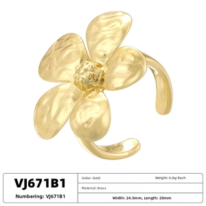 Detailed view of gold flower ring showing dimensions 24.5mm by 28mm and hammered brass texture