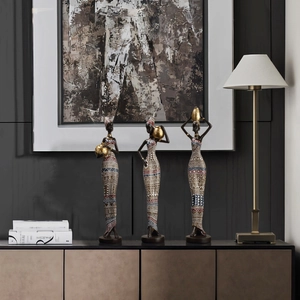 Three African tribal women figurines in ethnic attire for modern home decor set